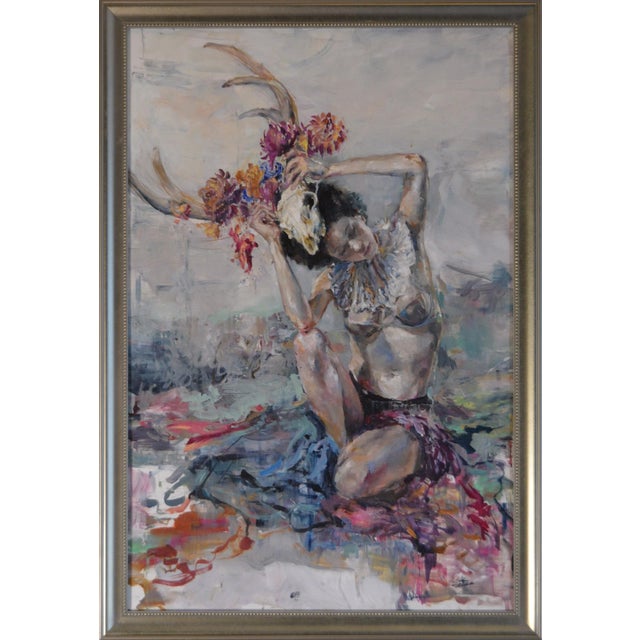 In "These Ghosts of Mine," a figure adorned with a skull and vibrant flowers strikes a contemplative pose, merging...