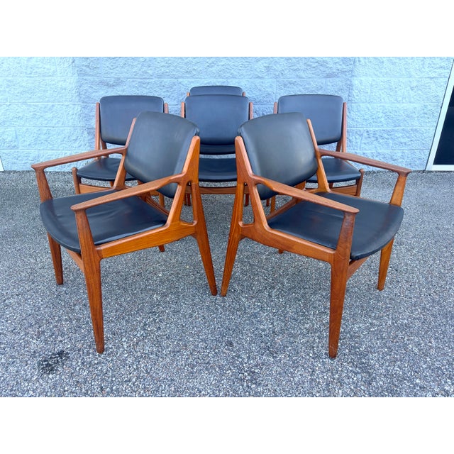 Set of six Mid-Century Modern Danish teak dining chairs designed by Arne Vodder for Vamo Sonderborg. This group includes...