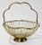 Vintage footed brass serving basket with scalloped form to rim and handle. Handle can rest low as needed. Fabulous patina.