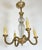 French Art Deco chandelier made around 1935-1940. It is made of brass, with heavily textured arms and diamond cut textured...