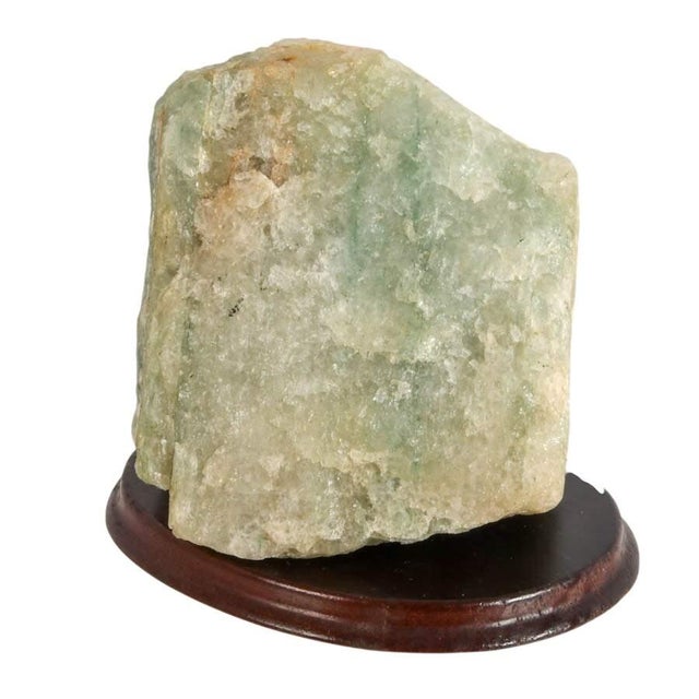 This Rough Natural Fluorite Mineral Specimen on Wooden Display Base is a captivating example of nature's artistry,...