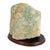 This Rough Natural Fluorite Mineral Specimen on Wooden Display Base is a captivating example of nature's artistry,...