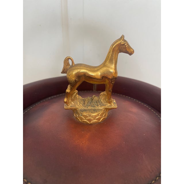 The Vintage Loyal Papeete Firetruck Brown Leather Brass Horse Handle Bar Ice Bucket is a unique and stylish addition to...