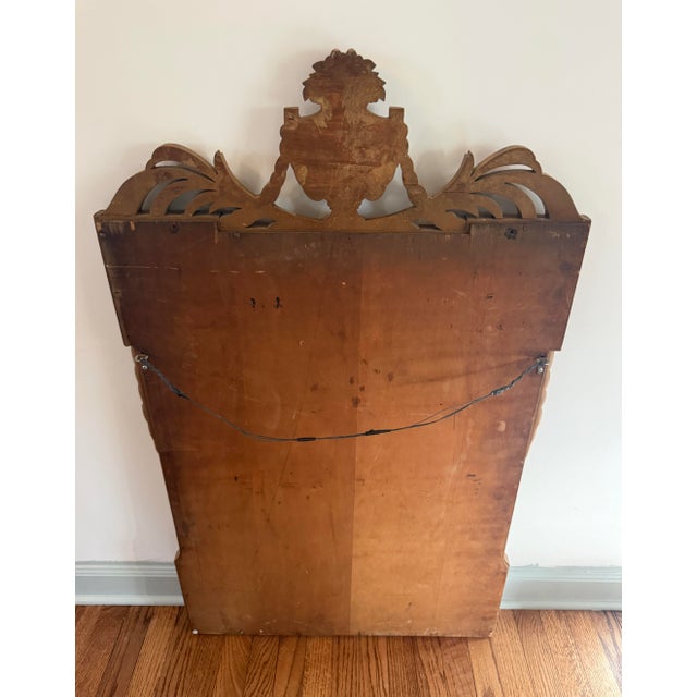 Beautiful heavy solid wood carved mirror in the Neo-Classical style with urn, wreath and floral motif. So lovely!