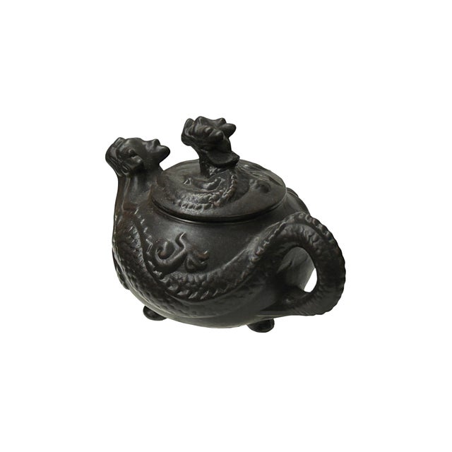 This intricately crafted Yixing-style clay teapot is a striking example of traditional Chinese zoomorphic design,...