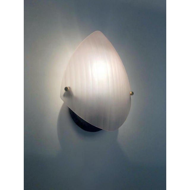 Pair of Italian Renzo Batini Wall Sconces Pair of Italian wall sconces in rose-tinted glass by the Renzo Batini lighting...
