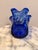 Add a bold pop of color with this stunning vintage cobalt blue hand-blown art glass vase. Featuring a graceful swirl...