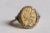 A carved oval citrine gemstone with a flower design, bordered with round, pave`-set diamonds. Set in an oxidized sterling...