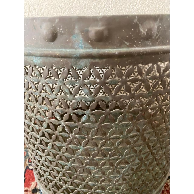 Vintage 1960's brass cylinder shaped cache pot with reticulated flower design and embossed stud detail on the top and...