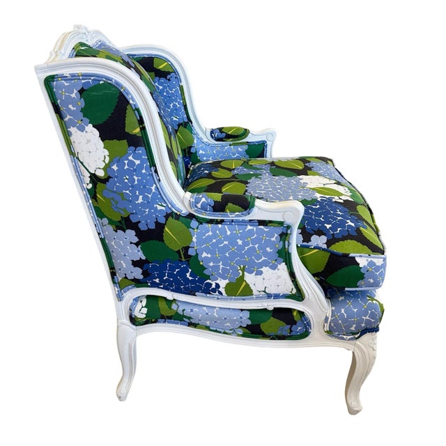 GORGEOUS vintage Bergere chair refinished in cloud white and covered in the stunning Hydrangea pattern by Schumacher. A...