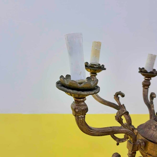 Item : this charming golden candelabra represents a perfect blend of elegance and sculptural art. Decorated with intricate...