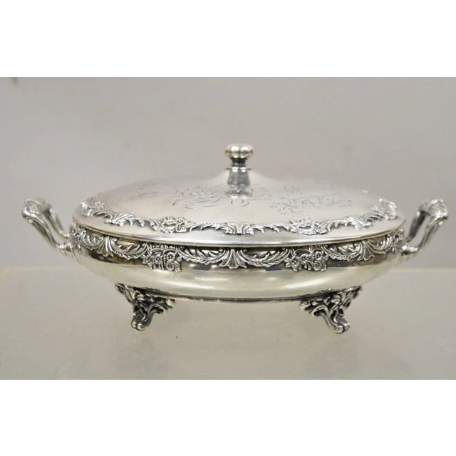 Reed & Barton Victorian Silver Plated Round Lidded Twin Handle Serving Dish. Item features an ornate lid, twin handles,...