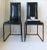 A beautiful pair of 1970s Italian Postmodern black leather and high-gloss metal chairs, circa 1970s, Italy. With label...