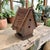 Elevate your decor with this Handcrafted Wooden Twig Roof Arts & Crafts Birdhouse, a stunning blend of natural materials...