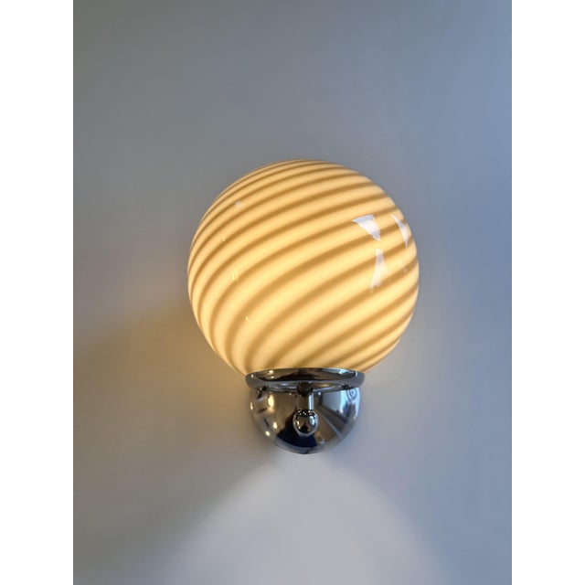 Luxury modern milky-white sphere with brown swirl in Murano glass . Very High Italian craftsmanship. Venetian rods make up...