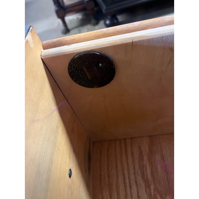 Three drawer campaign style chest by Hickory Manufacturing Company. Oak finish with brass campaign style accents and...