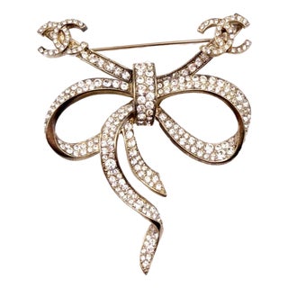 Chanel Gold CC Bow Ribbon Crystal Brooch For Sale