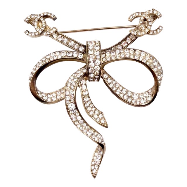 Chanel Gold CC Bow Ribbon Crystal Brooch For Sale