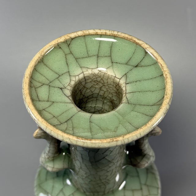 Antique Chinese Longquan celadon vase, decorated with a pair of phoenix-shaped side handles. Covered in natural crackle...