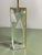 A striking and luxurious hollywood regency table lamp, featuring a substantial geometrically formed block of crystal-clear...