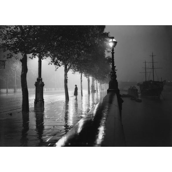 Rainy Embankment August 1929: A man standing alone on a rain-drenched pavement on the River Thames Embankment, London....