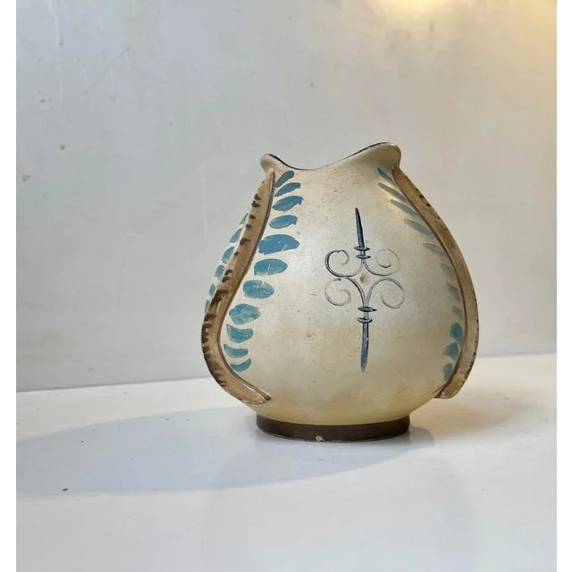 Unusual and organically shaped pottery vase decorated with worms or eels. Designed and manufactured by Knabstrup in...
