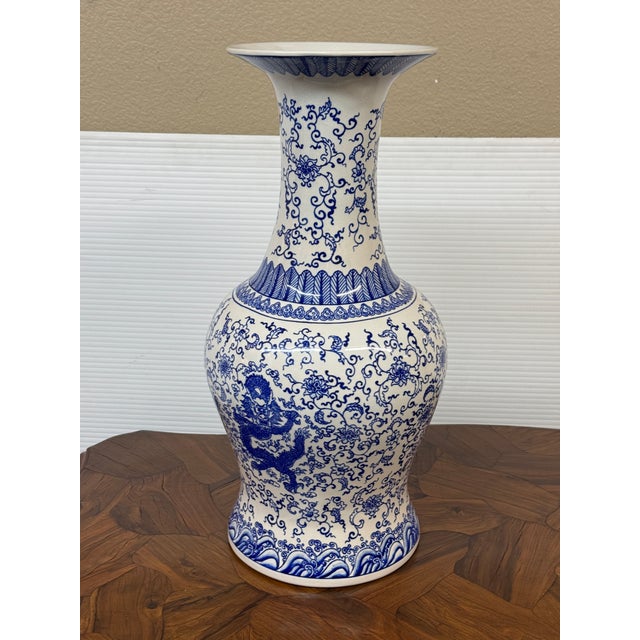 Design Plus Gallery presents a Blue and White Chinese Baluster Vase. The vase has a curvaceous, bell-like body that swells...