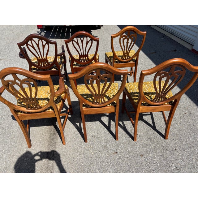 Bring a touch of retro elegance to your dining space with this set of floral Mid-Century Modern dining chairs. Featuring...