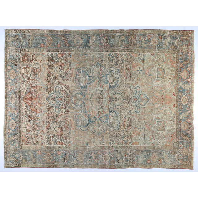 This authentic antique Heriz rug showcases the bold geometry and timeless artistry characteristic of Persian weaving...