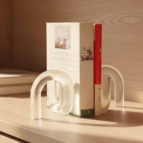 These bookends are designed in arches with a &nbsp;frosted, translucent finish. They are thick, sculptural acrylic....