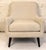 This is a mid-century styled cream lounge chair from Room & Board. The piece is comfortable with a deep sitting seat....