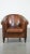 We are offering this cognac-colored, comfortable vintage sheepskin club chair with a generous seat. This stunning...
