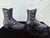 This charming pair of antique lady’s boots is crafted entirely in cast metal, most likely cast iron, and dates to the late...