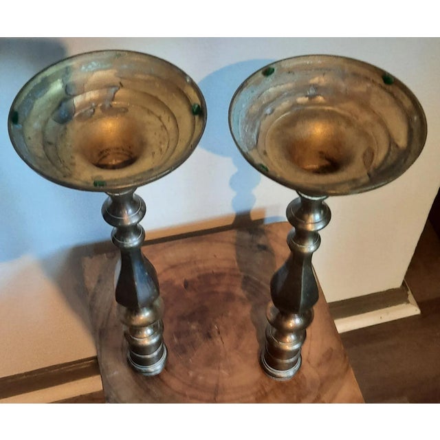 Market found, I love the large scale and vintage nature of these weathered brass candleholder offer. No makers mark.