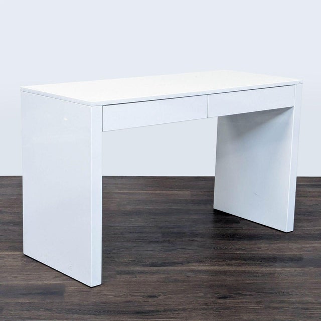 This sleek white desk features a clean, modern design that fits any workspace. It comes with two spacious drawers, perfect...