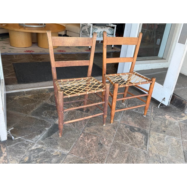 Design Plus Gallery presents a Set of 3 Antique Dining Chairs. The simple silhouette of each features ladder back rungs...