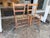 Design Plus Gallery presents a Set of 3 Antique Dining Chairs. The simple silhouette of each features ladder back rungs...