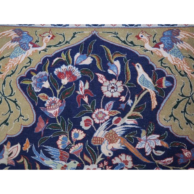 A fine hand-knotted rug from the famous Isfahan, made of cork wool on a silk warp. It stands out for its exceptionally...