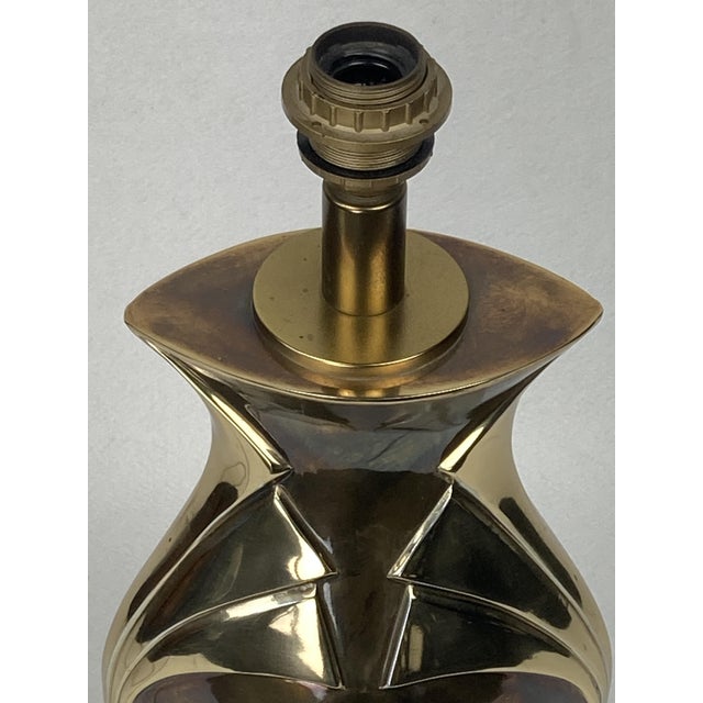 Table lamp by kullmann lampen, circa 1970s, the netherlands\. The brass body is vase-shaped, with a flared, angular...