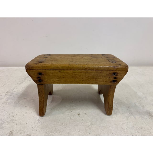 Small rustic stool Made from pine Primitive construction Arch cut side legs Timeworn patina Can function as a small...