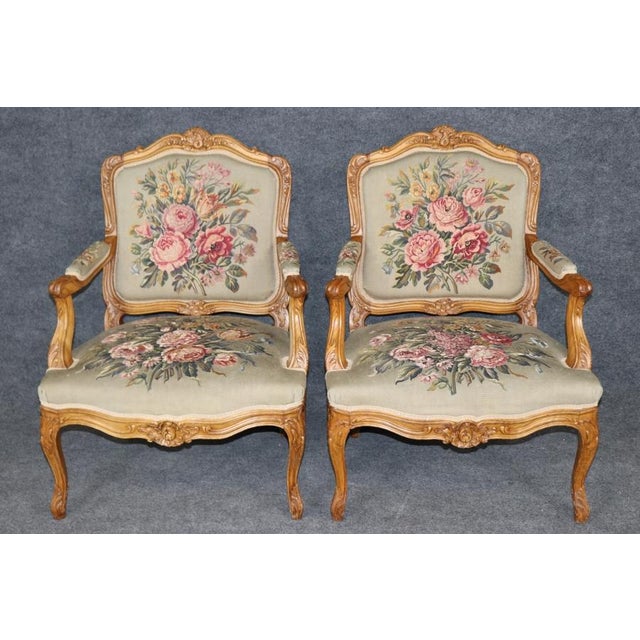 An exquisite pair of French Louis XV-style fauteuil armchairs, dating from the late nineteenth to early twentieth century,...