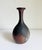 A wonderful example of Japanese Bizen ware from the 1970s. Features deep earthy tones of brown and red clay with a matte...