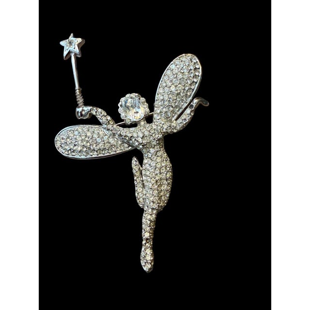 KJL vintage rhinestone fairy godmother brooch pin with star wand is fully covered in clear prong-set rhinestones on a...