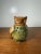 Vintage ceramic owl figurine featuring a green and brown glazed finish with pierced floral cutouts. Hollow pottery design...