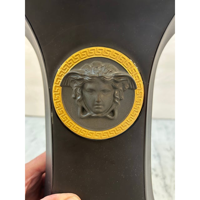 Gorgeous Rosenthal for Versace rich black shapely vase with gold trim and gold Medusa. Signed.