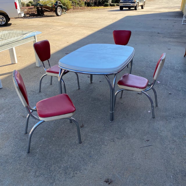 Adorable Arvin metal cherry red dinette table with four chairs. Perfect retro design to add character to any space and for...