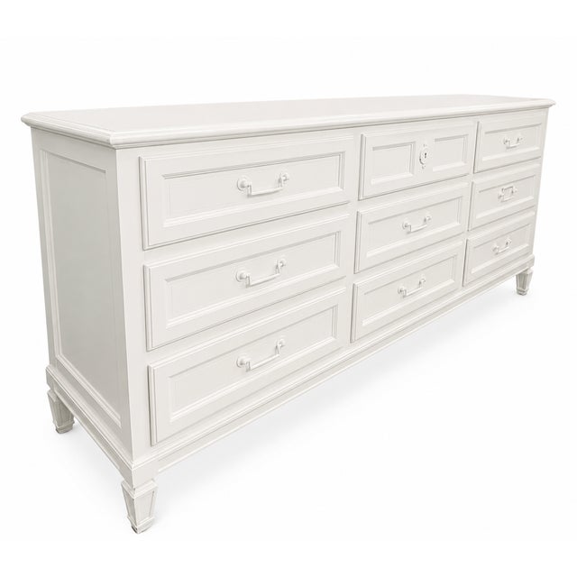 Vintage Baker Furniture nine-drawer dresser, masterfully crafted with the quality and timeless elegance for which Baker is...