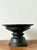 This vintage hand-carved pedestal bowl is a masterclass in organic texture and rustic charm, offering an authoritative...