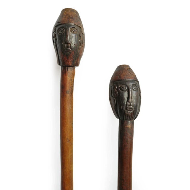 Rare pair of late 19th century Ethiopian tribal clubs or ceremonial staffs. These were hand carved from dense hardwood...
