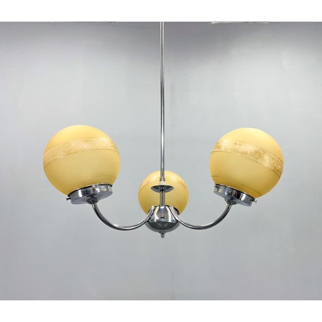 Mid century chrome three-arm chandelier with shades made of interesting sandblasted glass. Bulbs: 3 x E27(E26). US wiring...